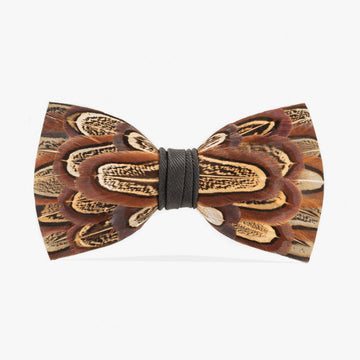 Elegant pheasant feather bow tie, showcasing a symmetrical oval pattern of rich brown and cream feathers with distinctive black markings, cinched with a black grosgrain center.