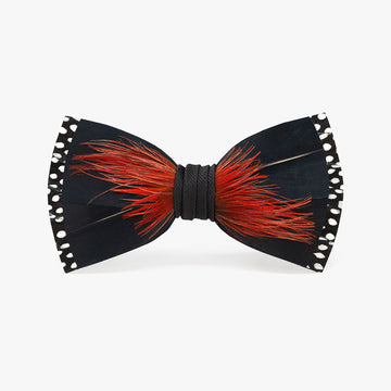The Big Spur 2.0 bow tie, inspired by the USC Gamecocks, features fine bold red feathers against a black background with white polka-dot accents, cinched with a textured black center band.