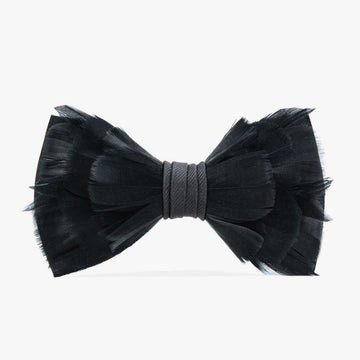 Black bow tie made from soft, layered feathers with a subtle sheen, tied together with a charcoal grosgrain center band, offering a bold yet sophisticated statement for formal wear.